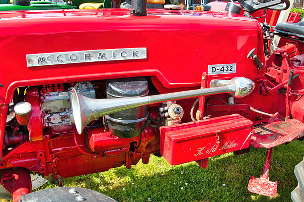 Uithuizen, Netherlands, 5-21-2022. Engine and classic chrome horn of a vintage McCormick D423 tractor at a classic car show in Uithuizen, Groningen, the Netherlands
