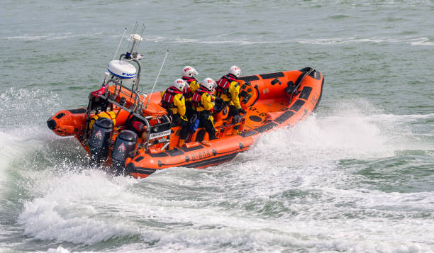Walmer, Kent, UK.  Sunday March  2nd 2025. The Kent coast Walmer lifeboat and crew during their regular Sunday Morning training in the English Channel , spin their rigid inflatable in a tight circle, practising manouverability .