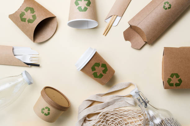 istock Paper disposable tableware with green recycling symbol 2202879667