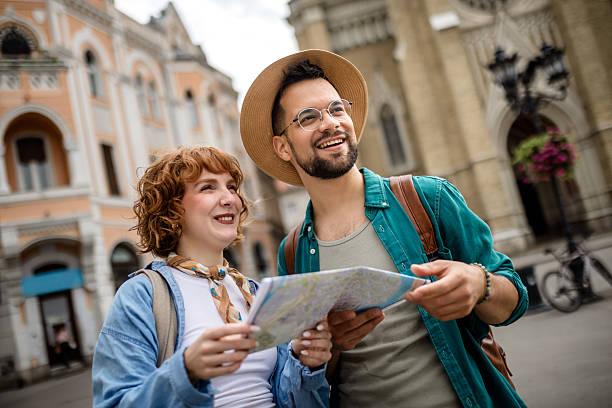 istock Young couple using a map to explore the new city on their vacation. 2202881884