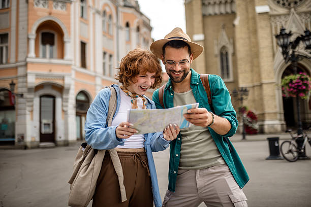 istock Young couple using a map to explore the new city on their vacation. 2202881889