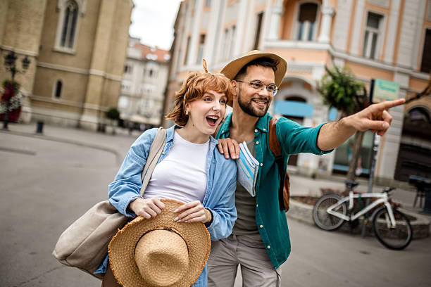 istock Young couple using a map to explore the new city on their vacation. 2202883002