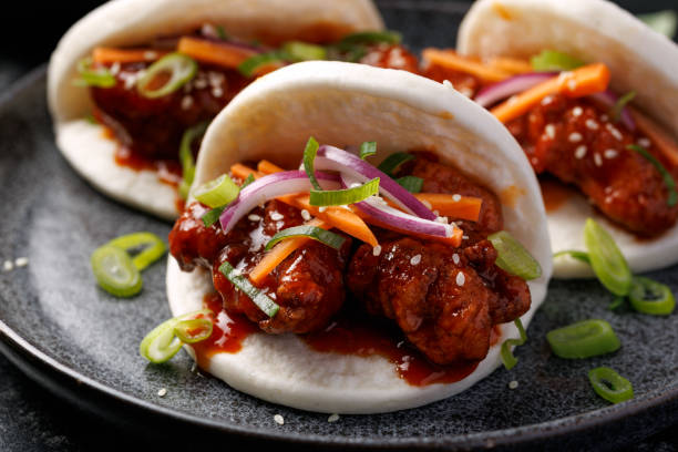 istock Korean Fried Chicken Bao Buns with vegetables. Asian fast food 2202883713