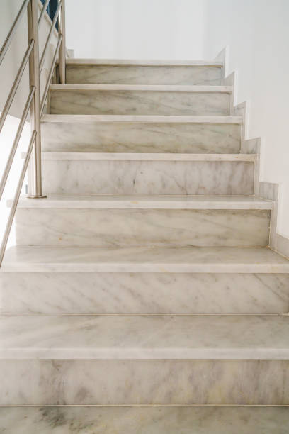 istock Modern staircase design featuring polished marble steps and a minimalist railing. 2202888122