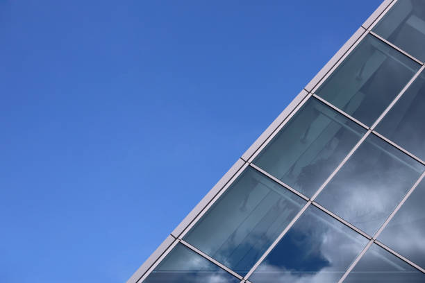 Construction frame on a building with a b sky in the background.