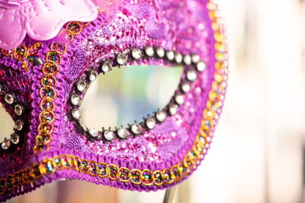 istock Carnival mask, beautiful carnival mask with colorful curtain background, selective focus. 2202890035