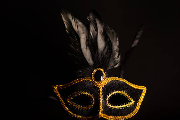 istock Carnival mask, beautiful carnival mask under dark surface, low key, selective focus. 2202890129