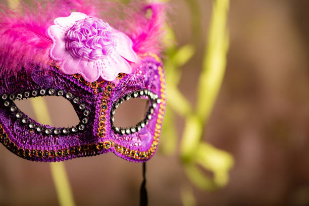 istock Carnival mask, beautiful carnival mask surrounded by serpentine, selective focus. 2202890472