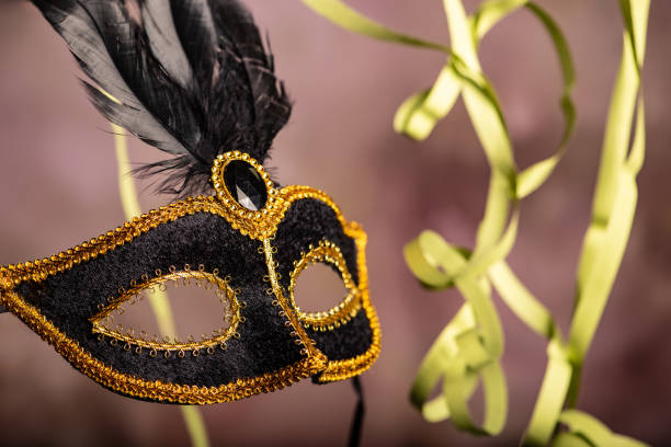 istock Carnival mask, beautiful carnival mask surrounded by serpentine, selective focus. 2202890555