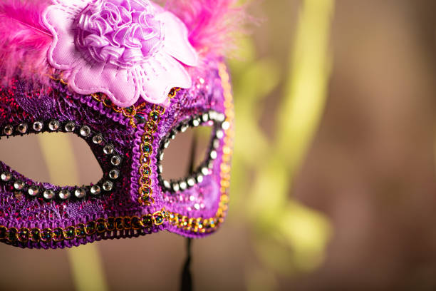 istock Carnival mask, beautiful carnival mask surrounded by serpentine, selective focus. 2202890556