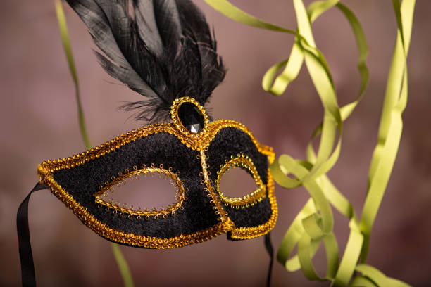 istock Carnival mask, beautiful carnival mask surrounded by serpentine, selective focus. 2202890560