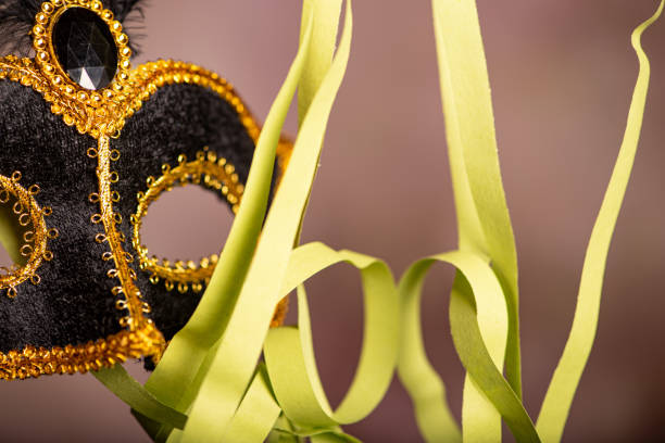Carnival mask, beautiful carnival mask surrounded by serpentine, selective focus.