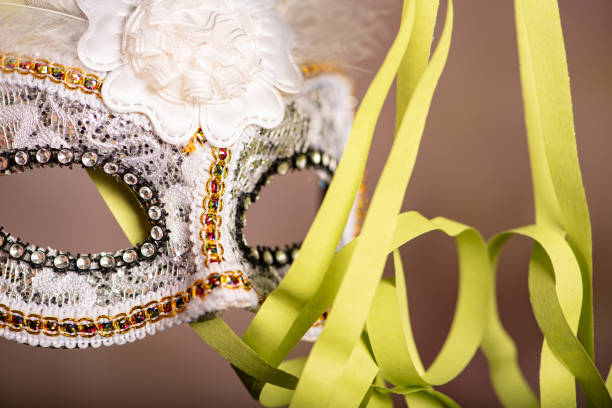 istock Carnival mask, beautiful carnival mask surrounded by serpentine, selective focus. 2202890624