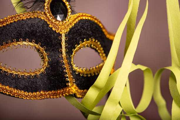istock Carnival mask, beautiful carnival mask surrounded by serpentine, selective focus. 2202890626
