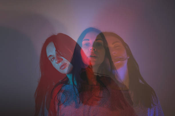 istock Woman portrait with colored lights. Triple Exposure 2202891930