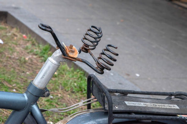 Close up shot of a vintage motorcycle leather saddle and toolbox.