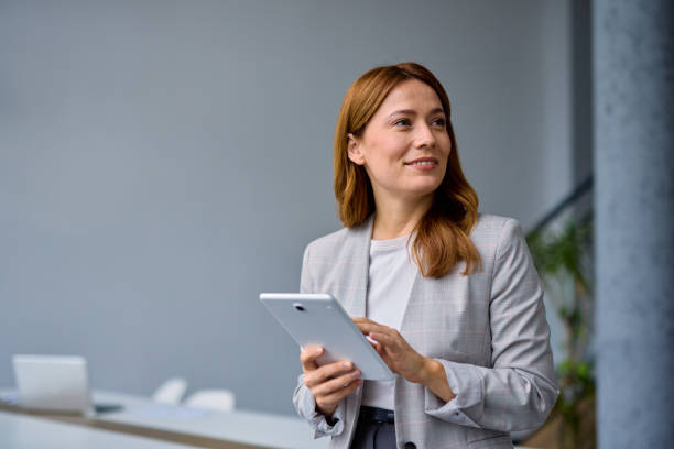 istock Businesswoman using digital tablet in modern office 2202893444