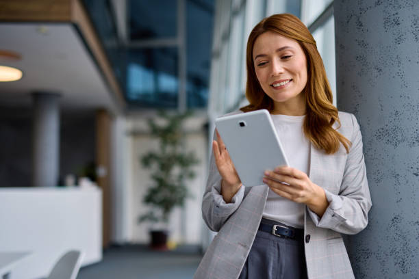 istock Businesswoman using digital tablet in modern office 2202893532