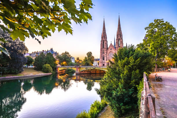 Saint Paul church in Strasbourg canal reflection sunset view, Alsace region of France