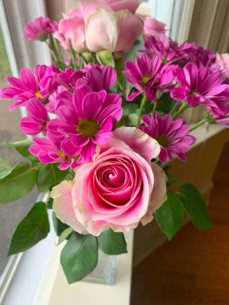 istock Vibrant Pink Roses and Daisies Bouquet 2202894857