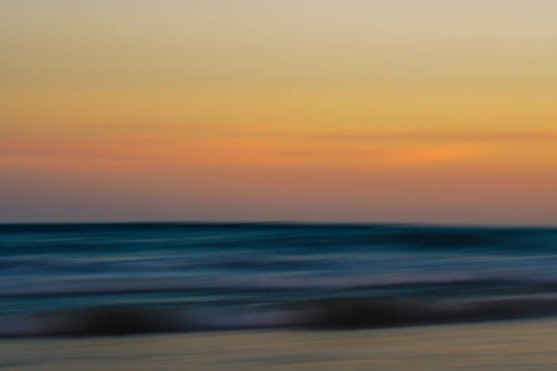 istock Flowing waves and soft colors blend to create a dreamy seascape. 2202896538
