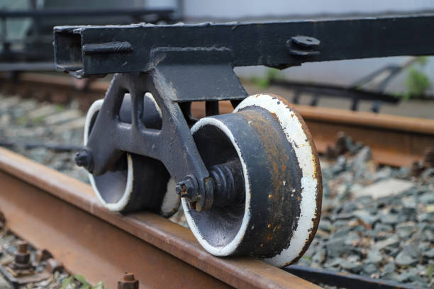 Close-up of vintage handcar wheels on rails. Industrial photo for themes on railway history