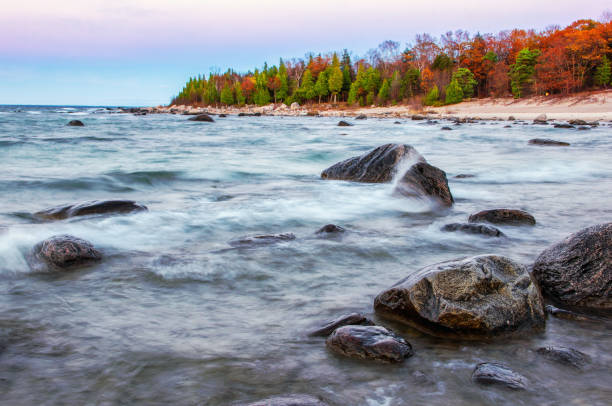 The cliffs are an outcrop of Devonian rocks on the right bank of the Gauja River.