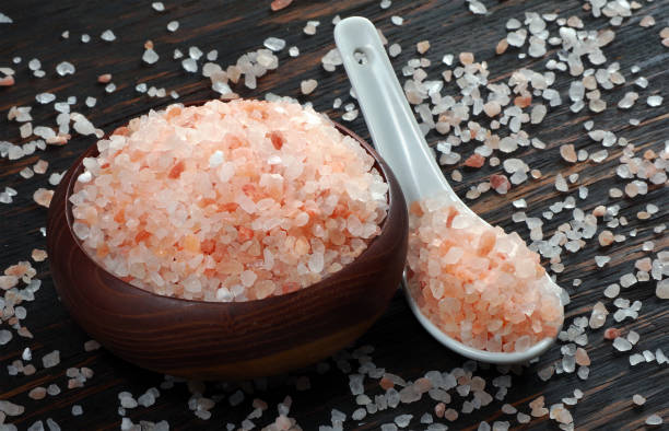 istock pink himalayan salt in a spoon on the table. 2202902667