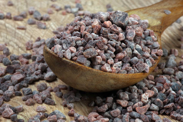 istock black himalayan salt in a wooden spoon on the table 2202902851