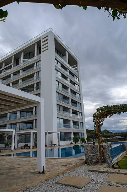 Modern architectural marvel with sleek lines and tranquil poolside ambiance at sunset