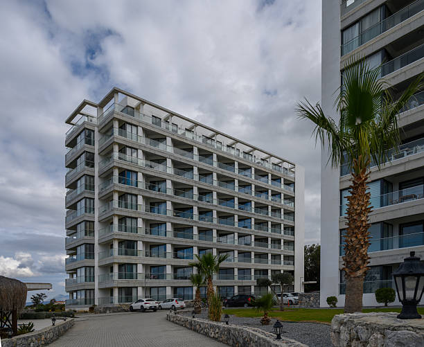 istock Modern architectural marvel stands tall amidst overcast skies in a serene coastal setting 2202915593