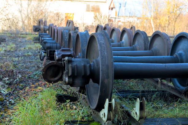 Rusty train wheels are lined up in an transportation maintenance railway yard, awaiting inspection is under restoration