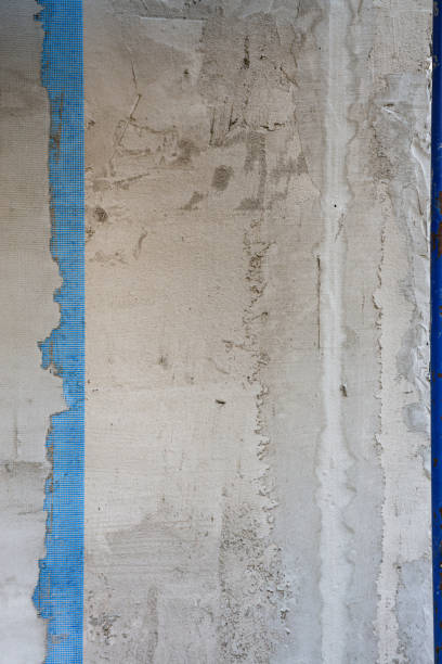 istock Vertical photo of an unfinished, unplastered wall. 2202920314