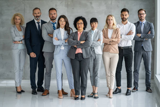 istock Confident business team posing together in stylish attire 2202920531