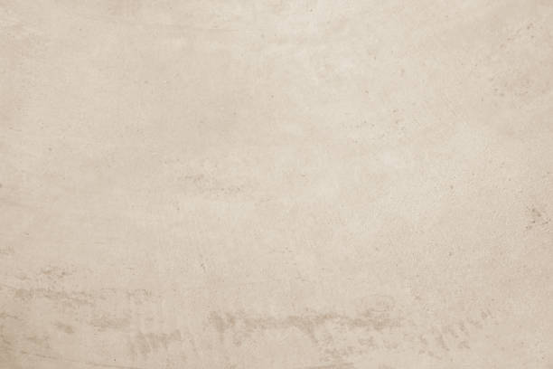 istock Colour old concrete wall texture background. Close up retro plain cream color cement wall background texture. Design paper vintage parchment element. 2202921952