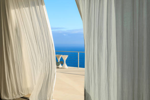 Lagonissi, Greece - March 28, 2015: View of the beach, blue sea and modern villas luxury hotel Grand Resort Lagonissi in spring.