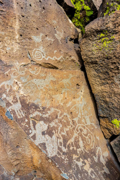 istock Ancient Native American Symbols Carved on Rock Panels 2202929928