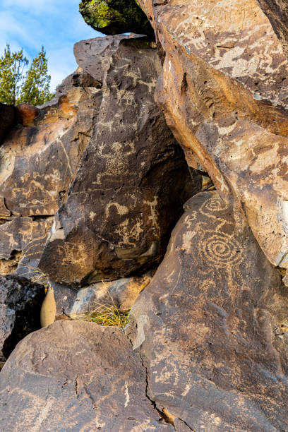 istock Ancient Native American Symbols Carved on Rock Panels 2202929933