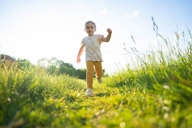 istock Happy Girl Running in Nature at Sunset, copy space. 2202936097