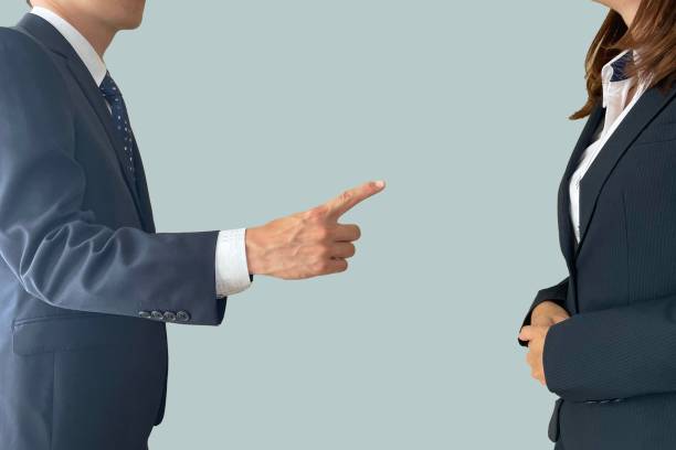 A male boss and a female subordinate giving warnings and power harassment