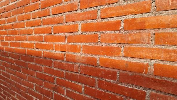 istock Big full frame background of detailed red brick wall with copy space. 2202954194