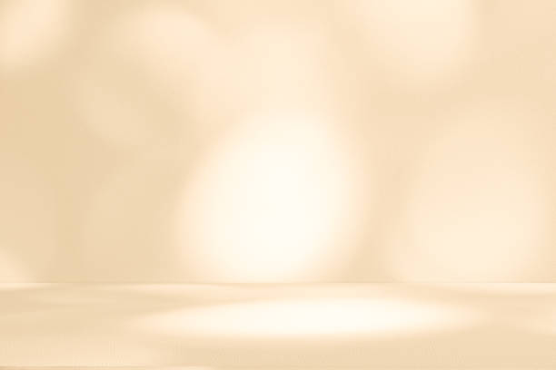 istock Studio style background wall decoration presentation uses white and beige tones. with shadows cast from a nearby window, concept creating a decorative 2202957322