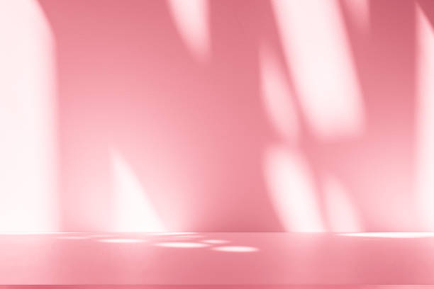 istock Wall interior background, studio, and backdrops show products. with shadow from window color white and pink light. background for text insertion and presentation of product 2202957385