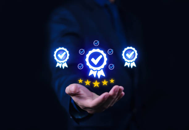 istock Businessman holding quality certification mark, audit, business, assurance, control, digital, service, complete, assessment, checklist, data with quality icon. 2202959125