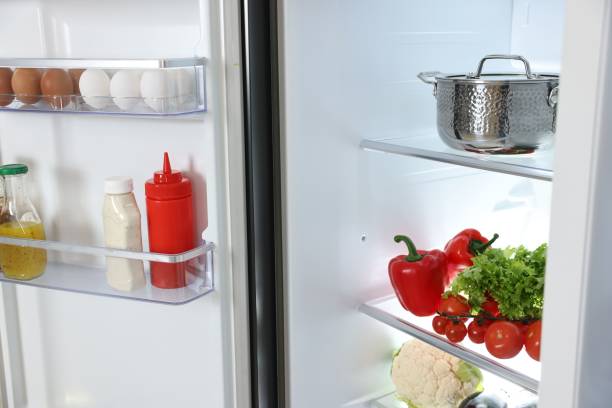 istock Modern open refrigerator full of different products 2202966510