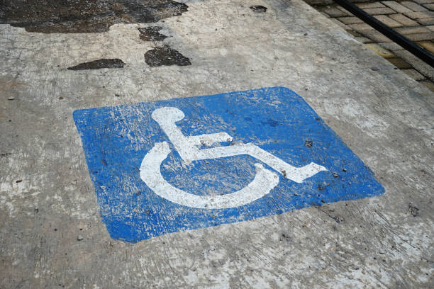 istock Disabled Parking Sign on Concrete Floor 2202970653