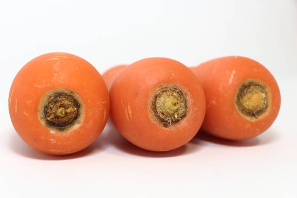 istock Carrot born from the soil, bathed in sunlight 2202978929