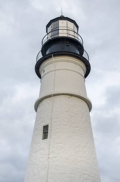 Portland Head Lighthouse is a historic lighthouse in Cape Elizabeth, Maine. The light station is automated, and the tower, beacon, and foghorn are maintained by the United States Coast Guard. The light station sits on a head of land at the entrance of the primary shipping channel into Portland Harbor, which is within Casco Bay in the Gulf of Maine.