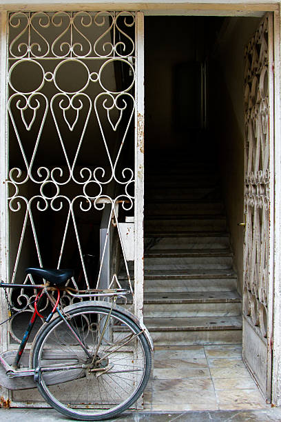 istock Building entrance and iron door with bicycle 2202981498