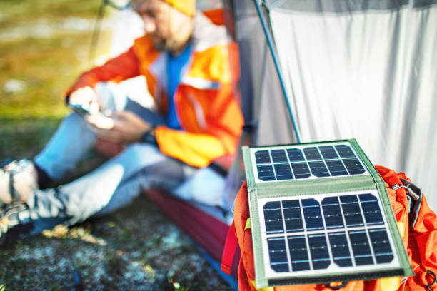 istock Mid adult man using mobile while camping in a mountain 2202986711